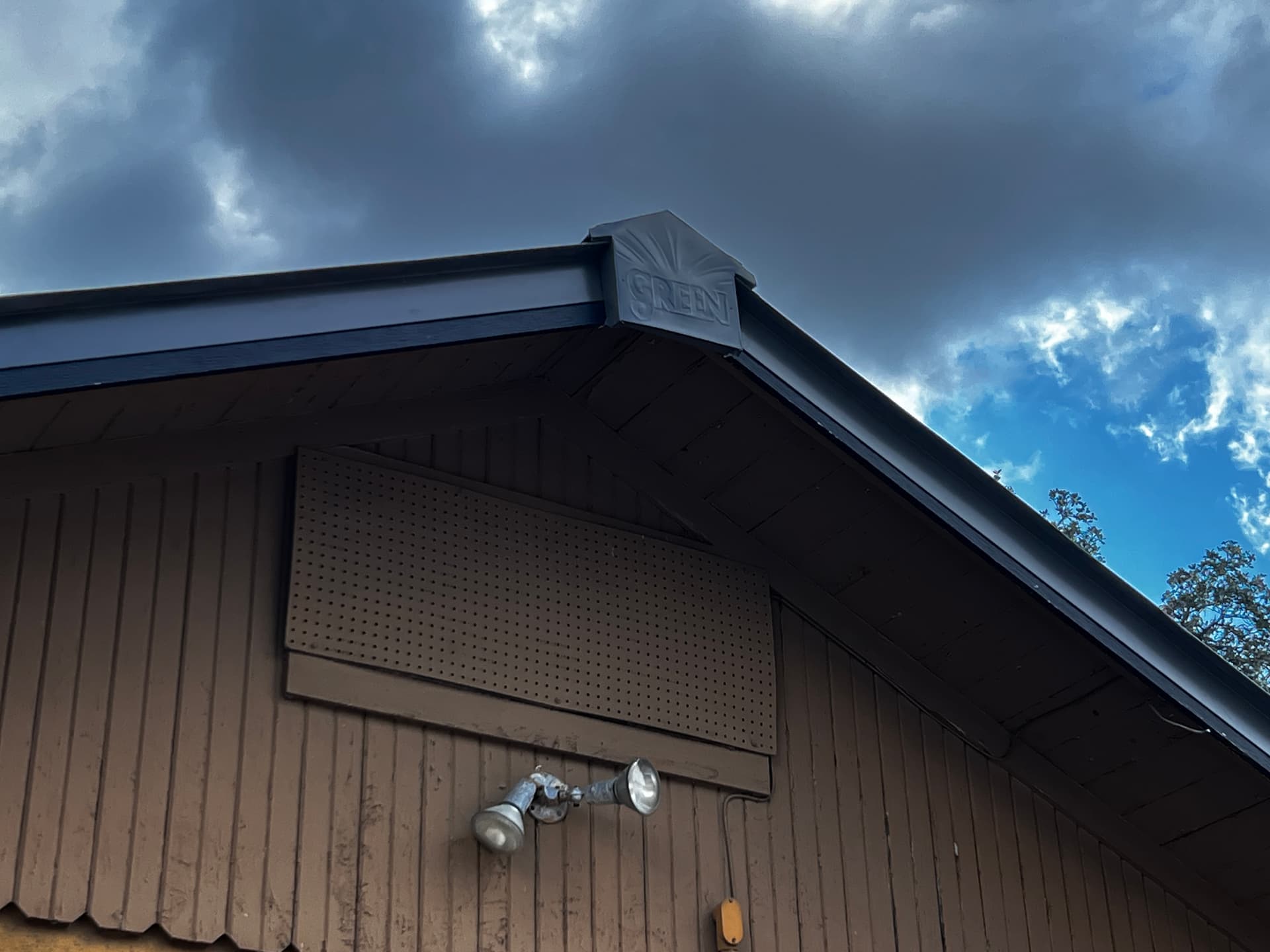Metal roof with hillside and deer